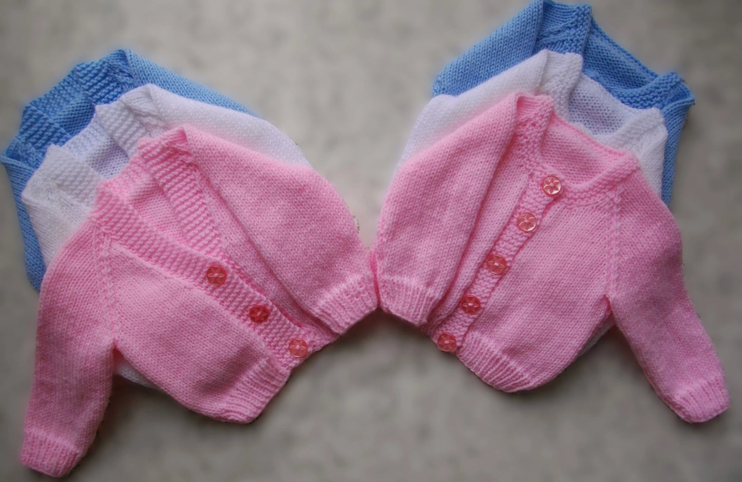 plain baby cardigans hand knitted from DollieBabies classic baby knitting pattern