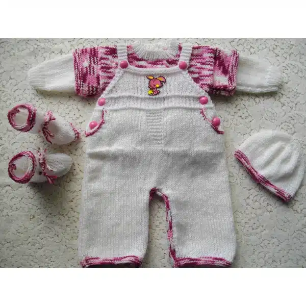 Girls version of knitting pattern 018 for a baby or reborn doll dungaree set