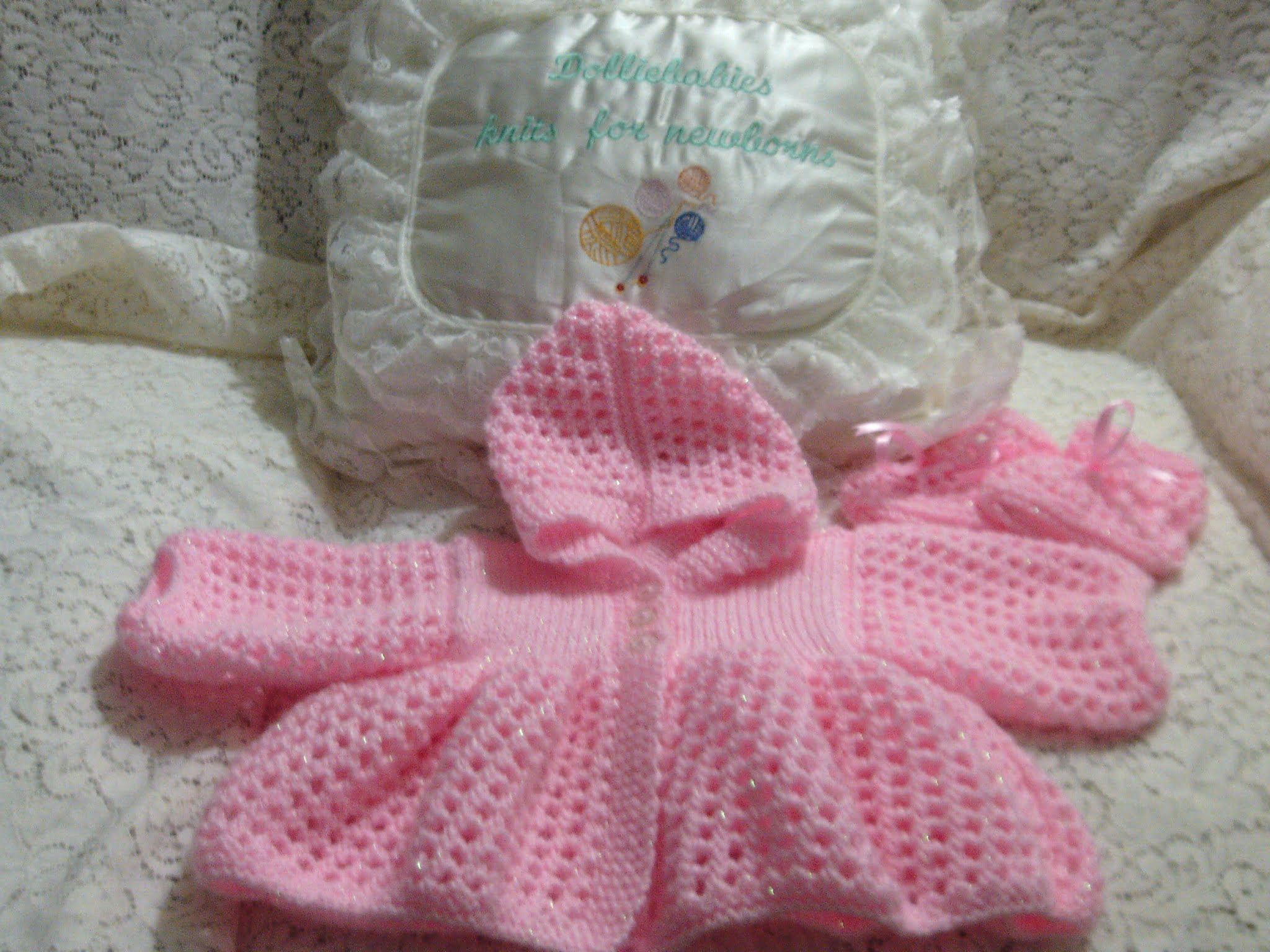 Free baby girl hooded matinee knitting pattern